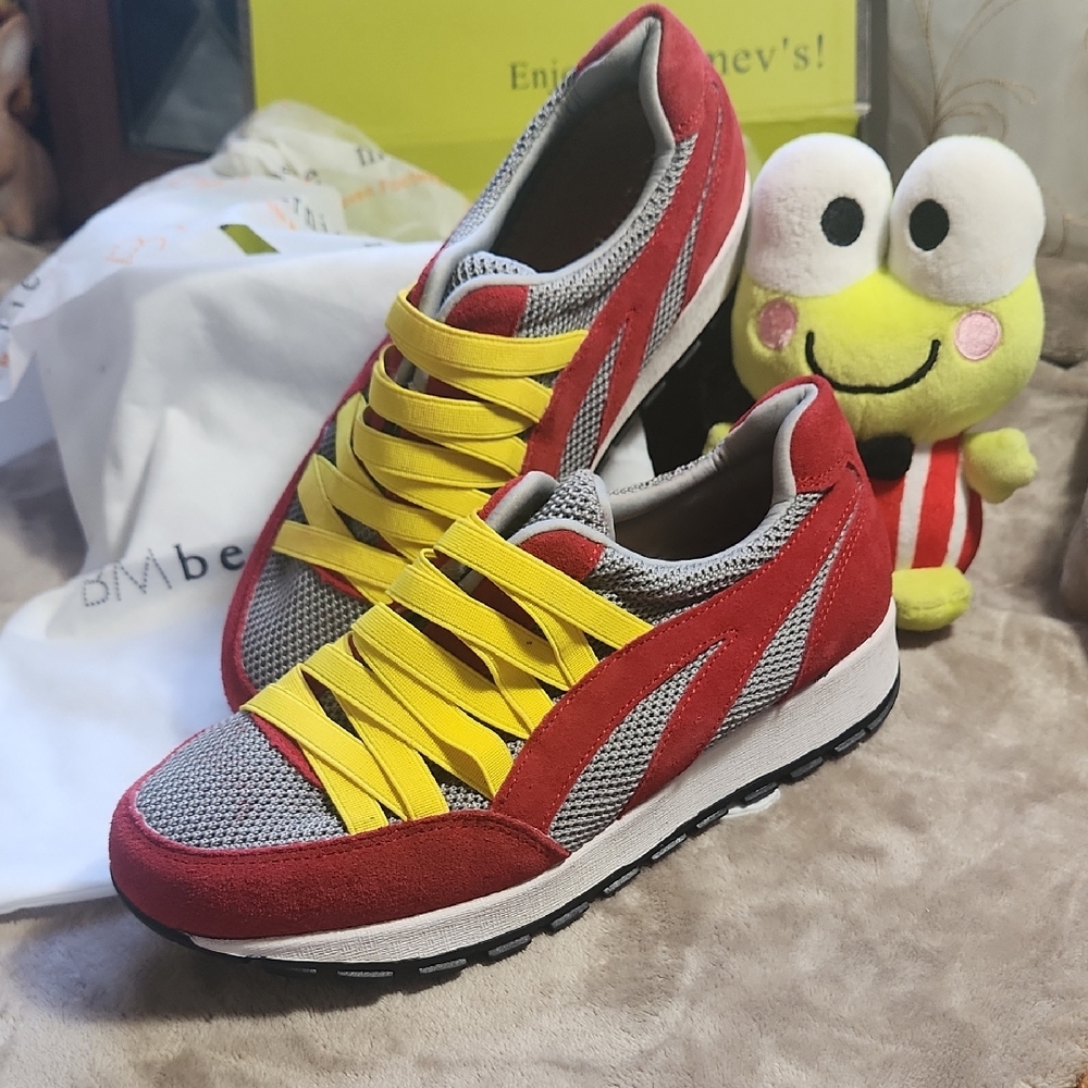 Red and Yellow Athletic Shoes